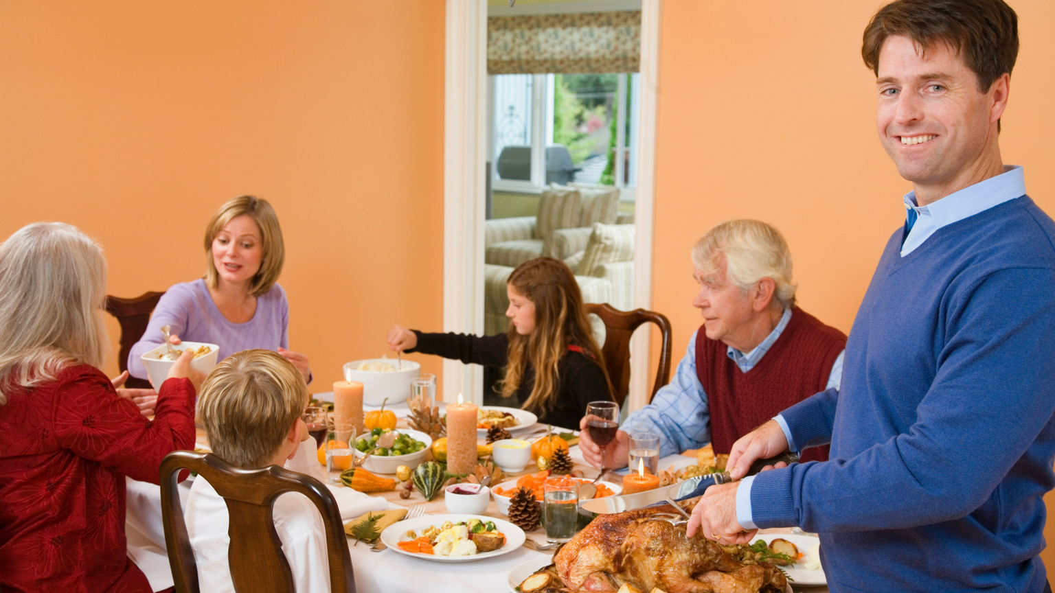 Man carving turkey