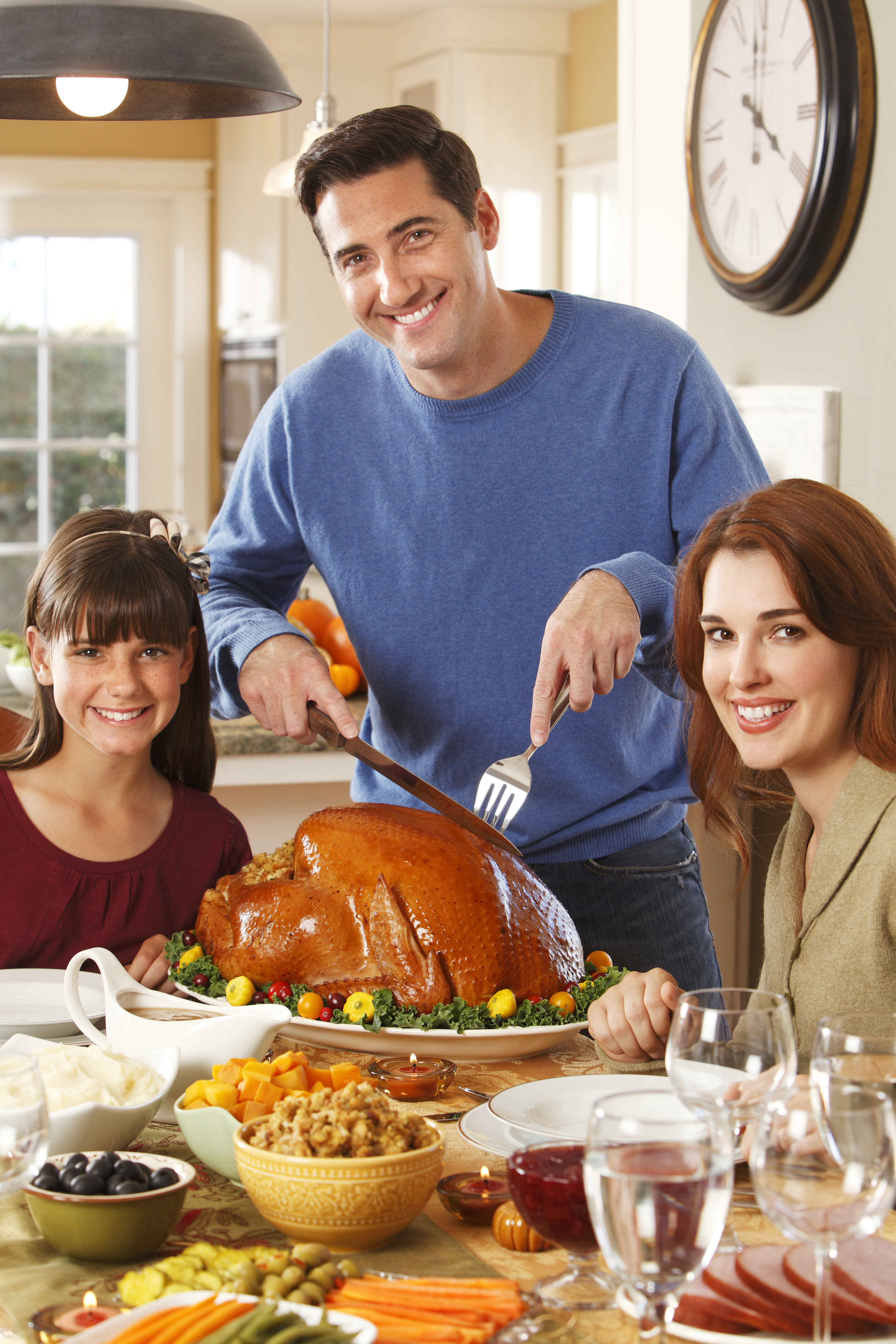 Father Carving Turkey for Thanksgiving Dinner