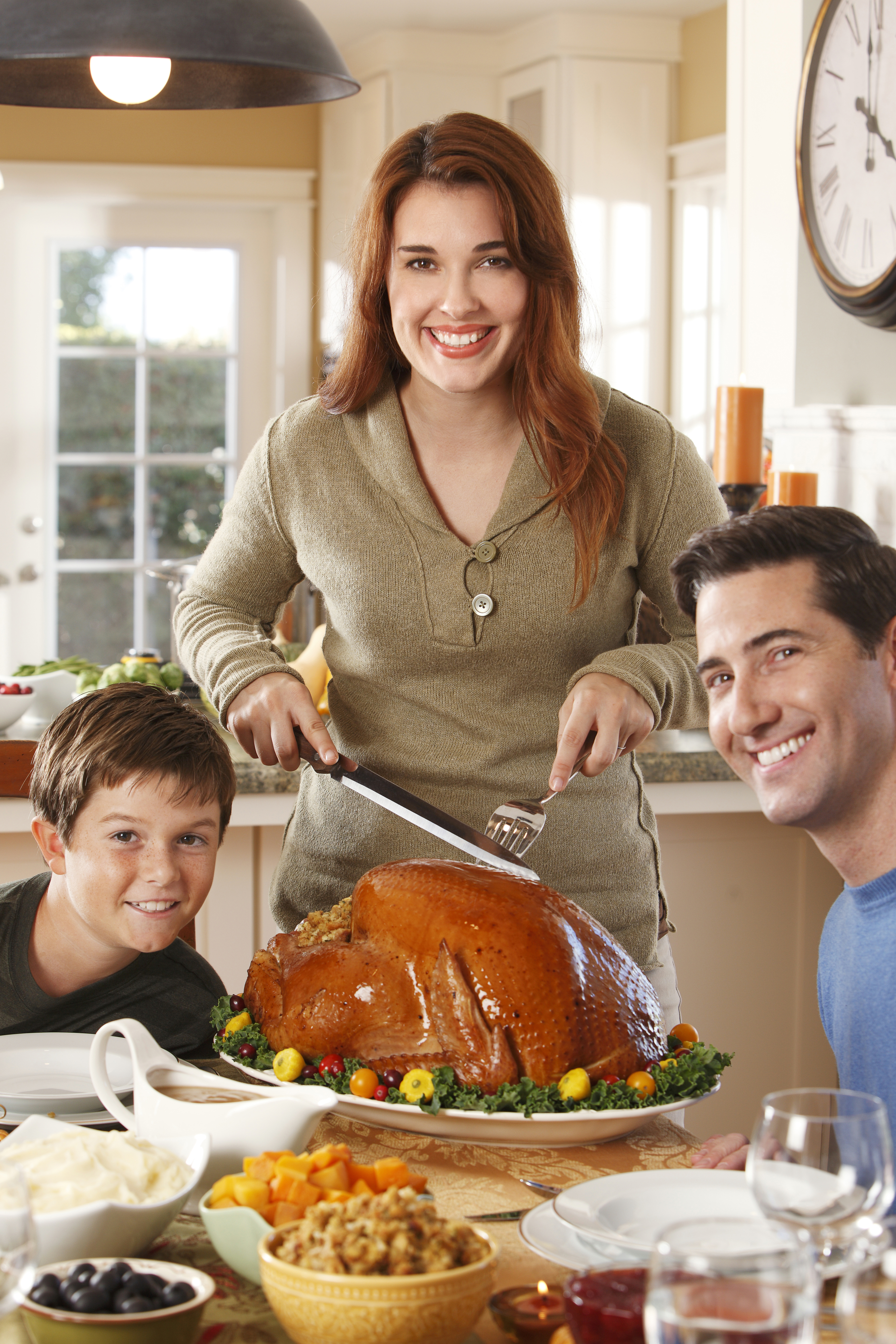 Mother Carving Turkey for Thanksgiving Dinner