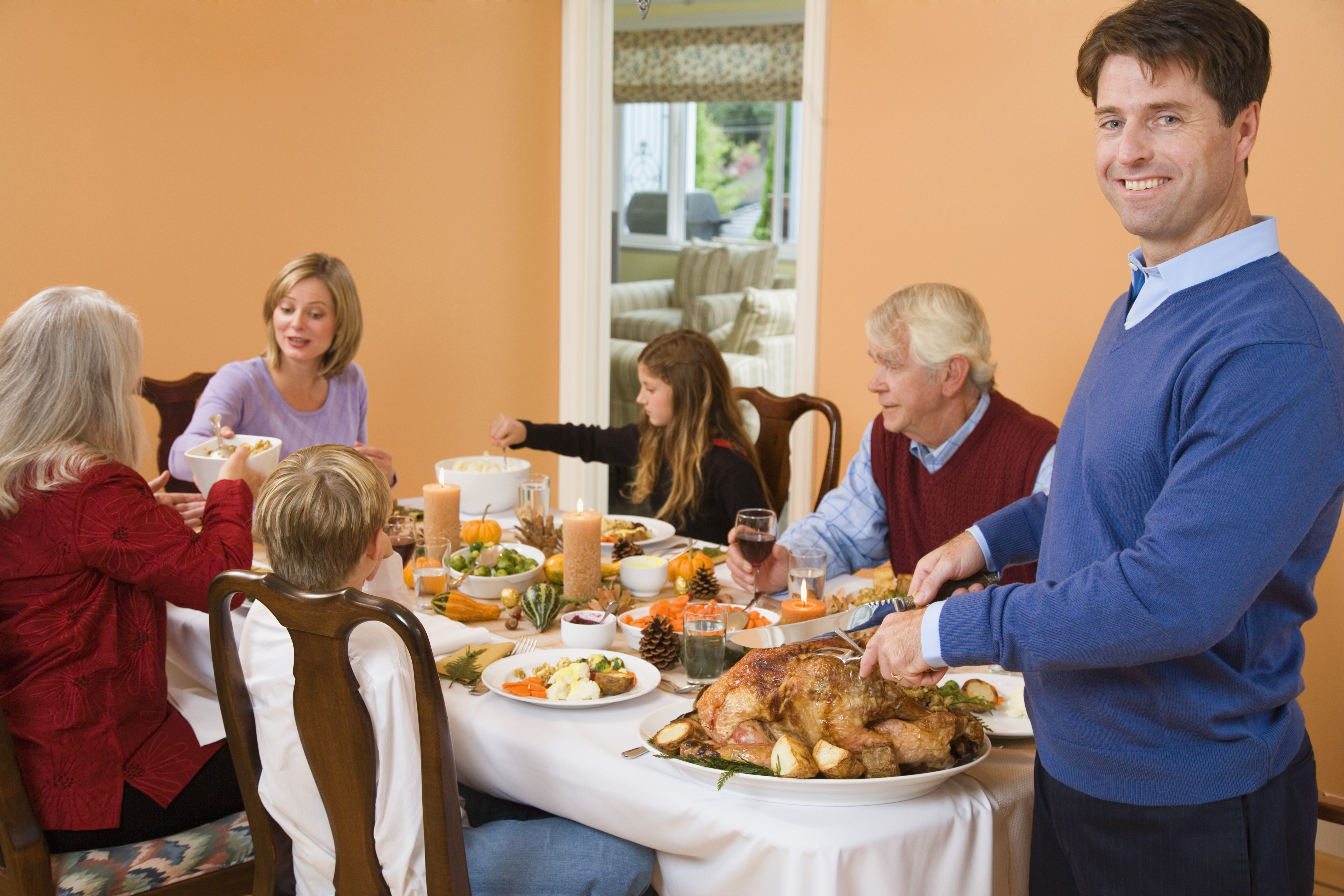 Man carving turkey