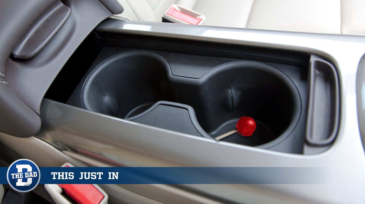 Dad Grudgingly Accepts That Cup Holder Now Used for Half-Eaten Suckers