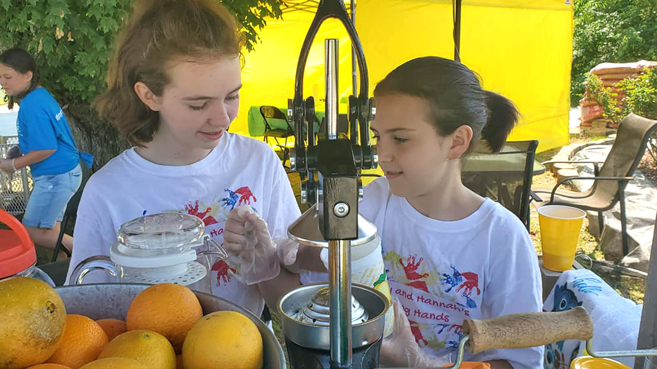 Sisters Run Lemonade Stand to Help Pay off Other Student's Lunch Debts