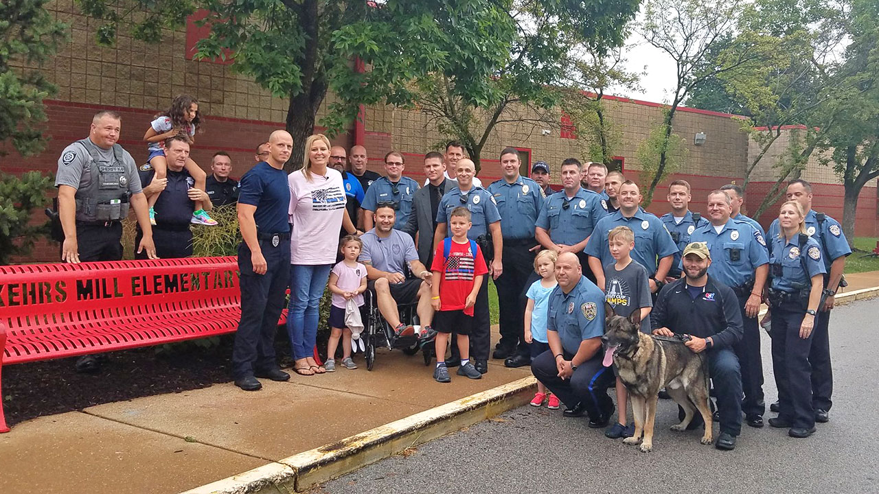 Police Sergeant Andy Mattaline takes Carmine to School