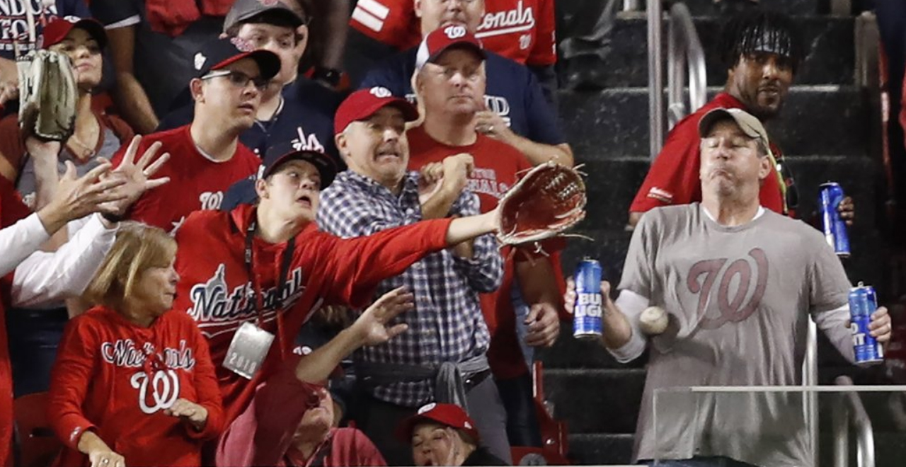 Fan Takes Homer to Chest to Save Beers