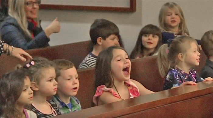 Kindergarten class celebrates peer's adoption