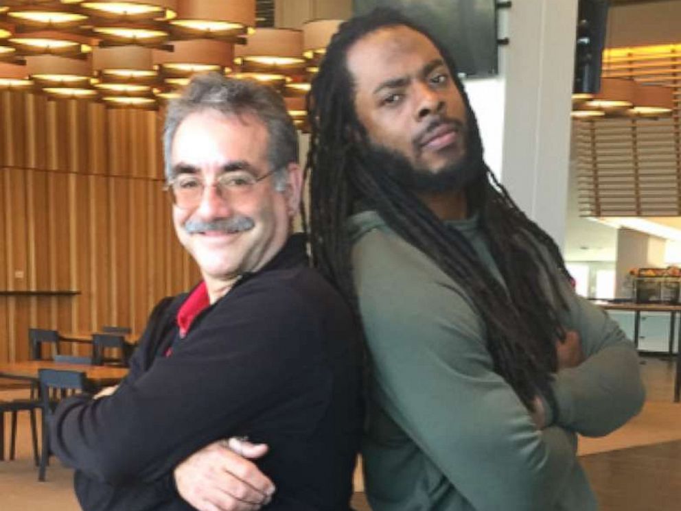 Principal Stan Garber poses with 49ers Richard Sherman