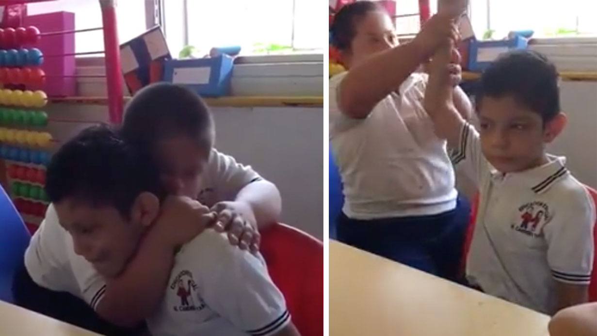 Boy With Down Syndrome Consoling Classmate With Autism