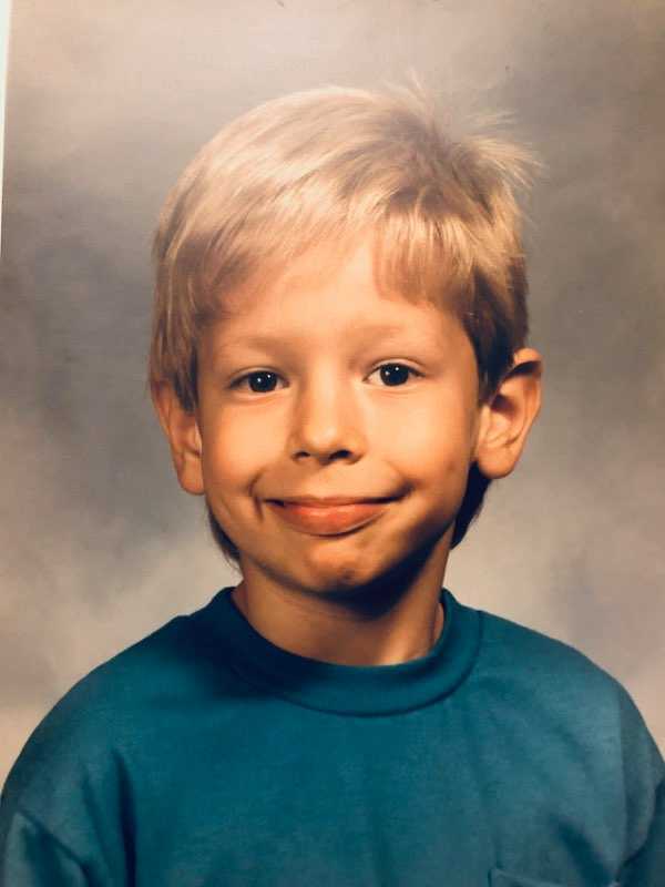 A Kid Making A Goofy Grin For School Picture Day