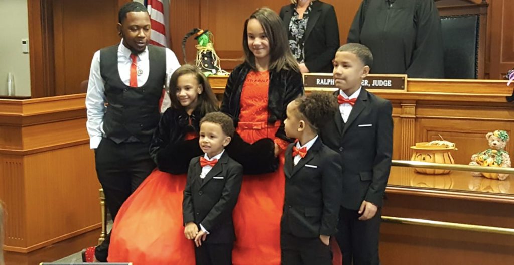 Single dad adopts five siblings to keep family together