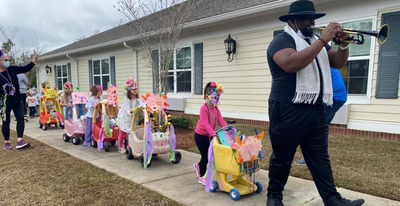 Preschoolers hold mardi gras parade for senior home