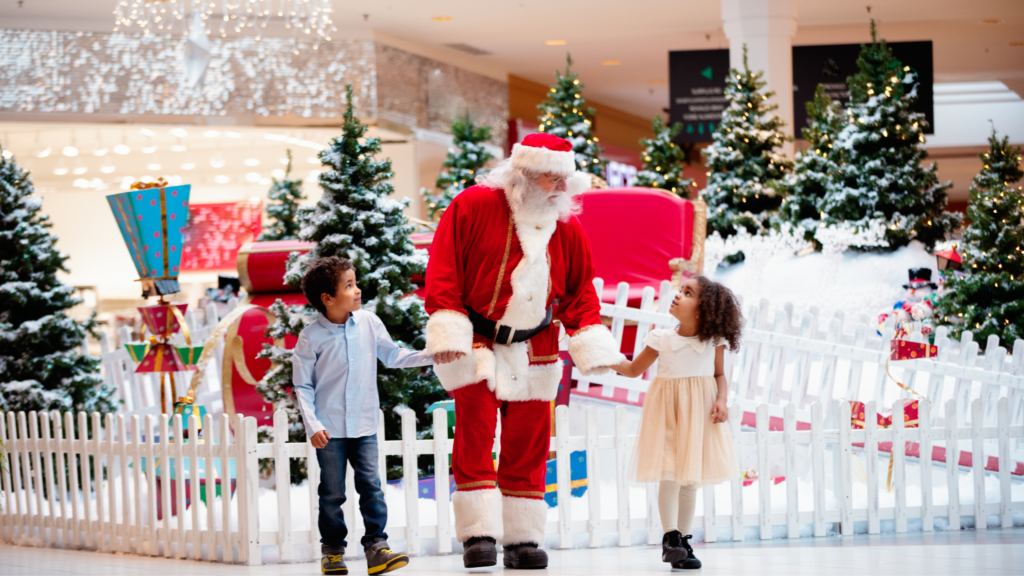 Shopping Christmas with family and Santa Claus at Shopping Mall